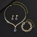 Detailed macro view of gold-plated bridal jewelry set with blue pear-shaped stones - 3-Piece Set (G229+746) / Gold-Royal Blue