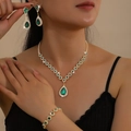 3-delige gouden damessieradenset met smaragdgroene kristallen en fonkelende diamanten - Goud + Groen