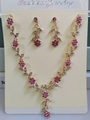 Detail of floral bridal jewelry set with pink rhinestones and gold alloy base - Rose Gold Tone Flower Necklace And Earrings (G361)