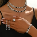 Elegant 4-piece sunflower jewelry set with silver finish and black stones on a model - Necklace Earrings Bracelet and Ring Set / Silver Black