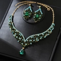 Detail of luxury jewelry set with V-shaped green crystal necklace and matching earrings - Gold Green