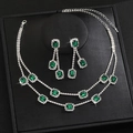 Detail view of emerald-cut green gems on a silver double-layered necklace and earrings set - Double Layer Square Main Stone Style (G390) / Silver Green