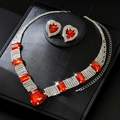Close-up of luxury heart-shaped red gemstone necklace and matching earrings set - G395 Red 2-Piece Set