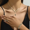 Elegantes goldenes Schmuckset mit Halskette, Ohrringen und Armband mit schwarzen Strasssteinen - Gold Schwarz 3-Teiliges Set