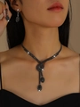 Detailed view of elegant black crystal necklace and earrings set on a model - 2-Piece Set (G431) / Black