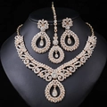 Golden bridal jewelry set with white rhinestones and pearls on a black display stand - Gold White (03)