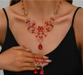 Elegant bridal jewelry set featuring red crystal necklace and teardrop earrings in gold finish - Gold Red