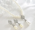 Elegant white pearl necklace and earrings set with crystal droplets for brides - Silver