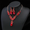 Elegant gold-tone jewelry set featuring teardrop red gemstones and matching earrings - Silver Red