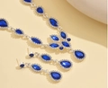 Elegant silver jewelry set with teardrop blue crystal necklace and matching earrings - Blue
