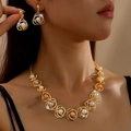 Elegant pearl necklace and earrings set with gold-plated rings and crystal accents - Gold Pearl