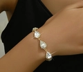 Close-up of elegant gold pear-shaped rhinestone bracelet worn on woman's wrist - Gold White Drop Style (779)