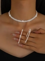 Macro detail of sparkling pavé zircon wavy choker necklace and oversized hoop earrings set - Silver Necklace Earrings
