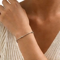 Close-up of minimalist silver metal bracelet with small bead accents on model's wrist - Round Bead Bracelet (Silver) 16+5