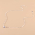 Minimalist silver chain necklace featuring a blue evil eye pendant and lobster clasp - Silver