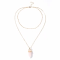 Detail of double-layer gold necklace with pink hexagonal crystal pendant and beaded chain - Rose Quartz