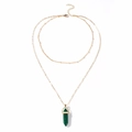 Close-up of gold double-layer necklace featuring a green hexagonal malachite stone pendant - Malachite green