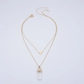 Double-layered gold necklace featuring a heart pendant and hexagonal crystal prism - Clear White