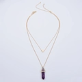 Detail of double-layer gold necklace featuring a heart pendant and purple hexagonal crystal - Purple Crystal