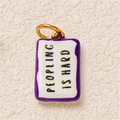 Rectangle enamel charm with Peopling Is Hard text in purple and 18K gold plating - Purple Square Slogan Pendant