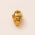 Detailed view of an 18K gold-plated stainless steel acorn pendant with textured cap - Strawberry Top Pine Cone Pendant