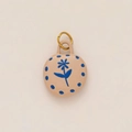 Close-up of a handmade ceramic rose pendant with blue floral patterns and gold metal ring - No 4 Oval Blue Flower