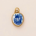 Detail of a vintage 18K gold plated pendant with blue and white porcelain house motif - Oval House Style (No.9)