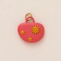 Detail view of a pink enamel sun and star moon pendant with 18K gold plating - Pink Sun and Star Style
