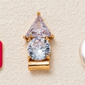 Detailed macro view of gold-plated copper pendant featuring triangle and round cubic zirconia - Rhinestone Pendant