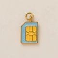 Macro view of blue enamel SIM card pendant charm with 18K gold plated steel details - SIM Card