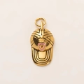 Macro shot of 18K gold baseball cap pendant with pink heart detail for DIY jewelry - Baseball Cap