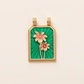 Macro shot of rectangular green enamel tarot pendant with gold floral engravings - Flower
