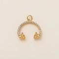 Macro shot of 18K gold plated headphone charm with sparkling crystals for jewelry making - Rhinestone Headphones