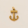 Macro view of vintage gold anchor pendant with fine matte texture and top hanging ring - Anchor Charm