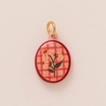 Detailed view of oval ceramic pendant with pink plaid pattern and vintage floral artwork - Oval White Flower (No. 2)