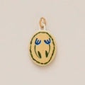 Detail of oval ceramic charm with blue floral pattern and gold jump ring attachment - Small Blue Flower Oval