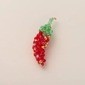 Handmade red beaded chili pendant with green leaves and a golden metal ring clasp - Chili
