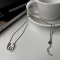 Detailed shot of silver handcuffs pendant with Freedom engraving on fashion chain - Handcuff Necklace