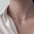 Minimalist silver necklace with round white pearls on a fine chain shown on model - Gold Minimalist Multi-Bead Pearl Choker (XL1080-13)
