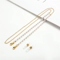 Detail of gold-plated chain with white faux pearls and silicone loops for glasses - White Pearl Gold