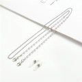 Detail view of pearl beaded eyewear chain with silver lobster clasps and silicone loops - White Pearl Silver