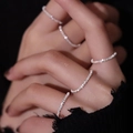 Close-up of sparkling silver rings with shimmering sand texture layered on hand - Silver / HK Size 14