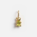 Detail of 3D bear pendant with gold plating and green gemstone on light background - Bear Shape Pendant / Gold/Yellow-Green