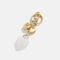 Golden heart keychain featuring a large milky white resin pendant and sturdy snap hook - Triple Heart Keychain