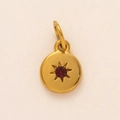 Golden December birthstone necklace pendant with red zircon and starburst engraving detail - January Birthstone Pendant