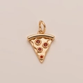 Detailed view of pizza-shaped gold-plated pendant with sparkling red crystals - Pepperoni Pizza Slice Pendant