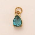 Detail of pear-shaped sea blue gemstone pendant in 18K gold plated clover mount - Aquamarine Pendant