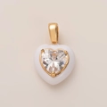 Detailed view of a white heart pendant with gold trim and heart-shaped zircon stone - Heart Pendant / White