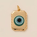 Detailed close-up of golden rectangular Evil Eye pendant with blue inlay and glitter accents - Eyeball Square Tag