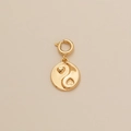Gold-plated yin yang pendant with heart details and spring clasp on minimalist background - Bagua Yin Yang Pendant